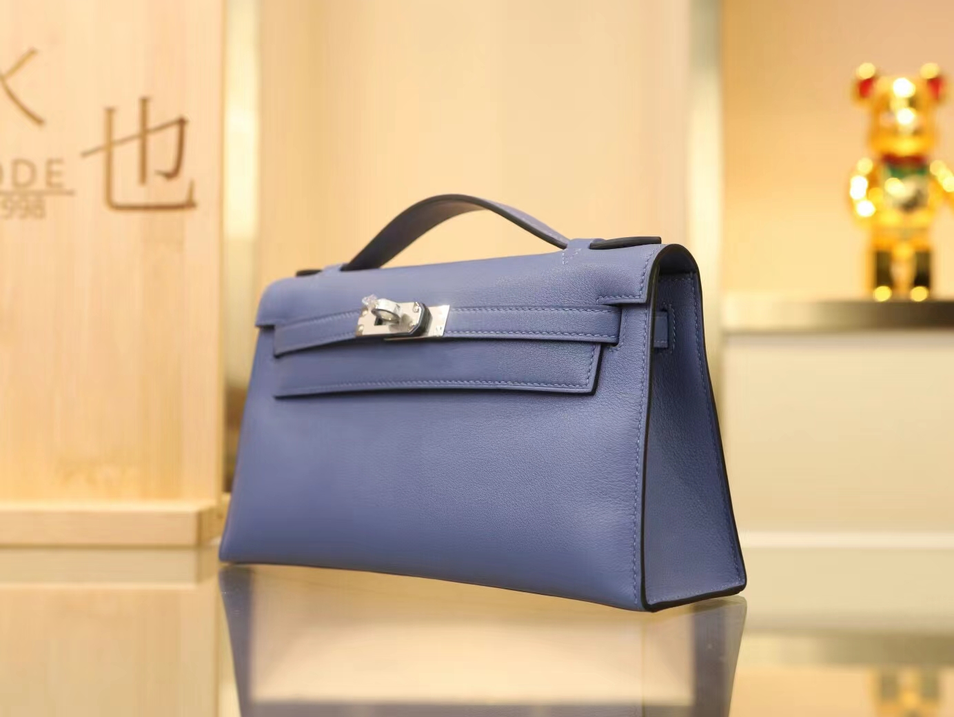 水也名品Hermes Mini Kelly Pochette22cm 7E明蓝色Swift牛皮手拿包 银扣